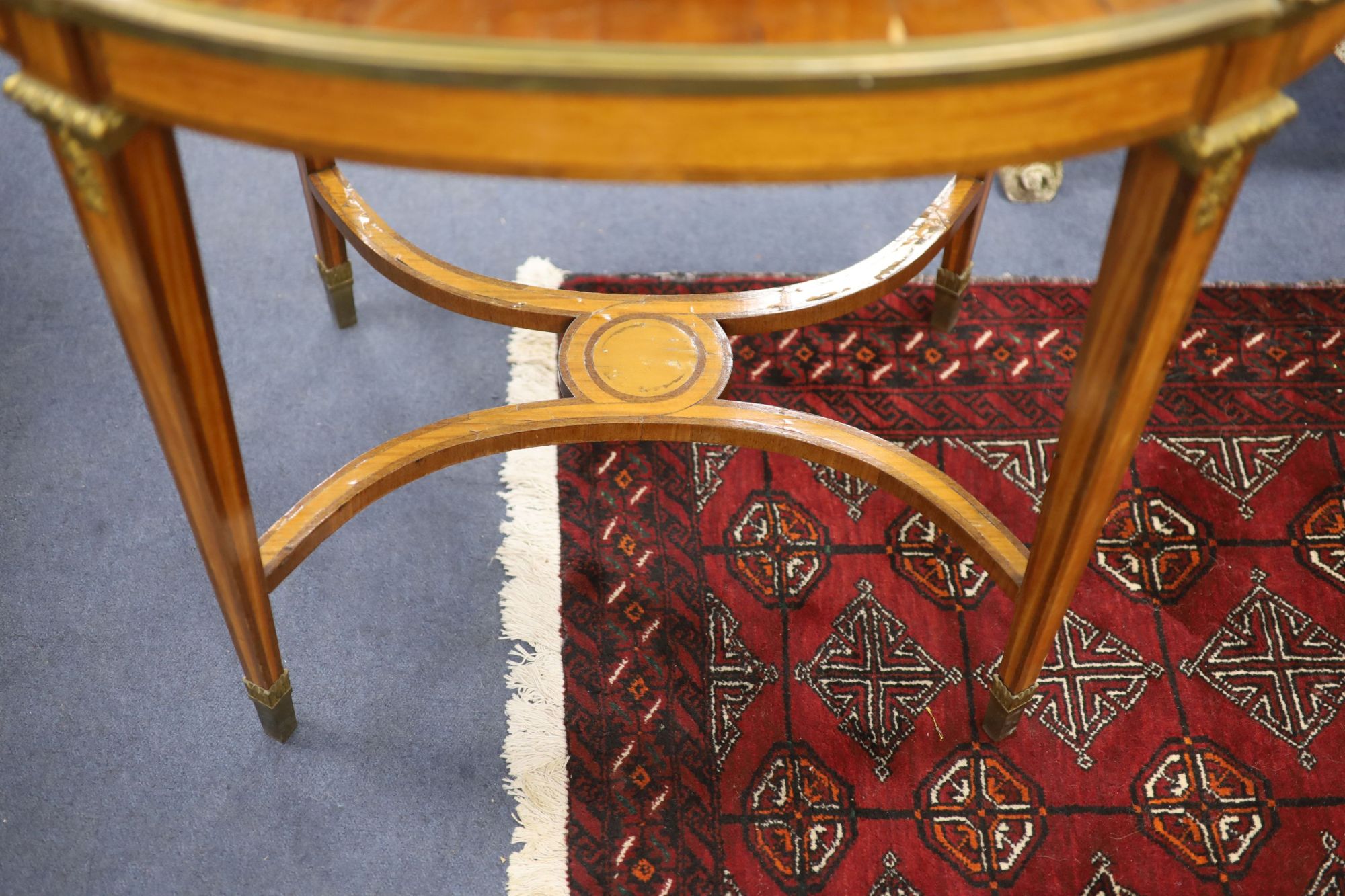 A late 19th century French satinwood, rosewood crossbanded and gilt metal mounted two tier oval etagere